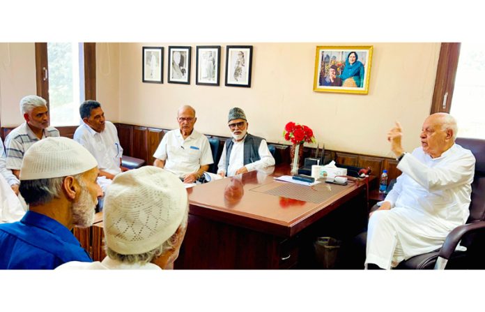 NC president Dr Farooq Abdullah during meeting with party functionaries in Srinagar.