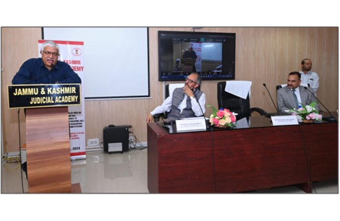 Justice Atul Sreedharan delivering lecture during sensitization programme on Saturday.