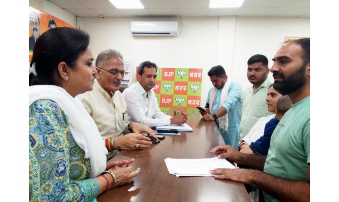 BJP leaders listening public grievances at Party headquarters Trikuta Nagar on Tuesday.