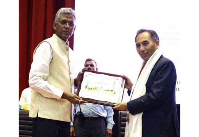 A dignitary welcoming Chief Justice Tashi Rabstan at IIM Jammu on Friday.