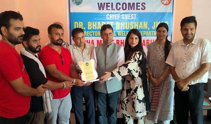 DSW Jammu, Dr Bharat Bhushan, honouring an NGO working against drug abuse in Kathua on Wednesday.