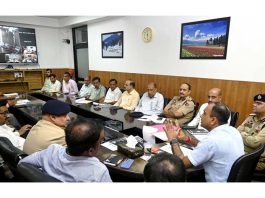 Div Com chairing a meeting at Jammu on Friday.