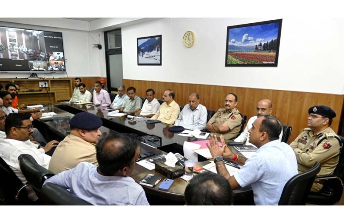 Div Com chairing a meeting at Jammu on Friday.