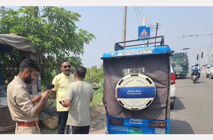 MVD team inspecting an e-rickshaw during a drive against violations in Jammu on Thursday.