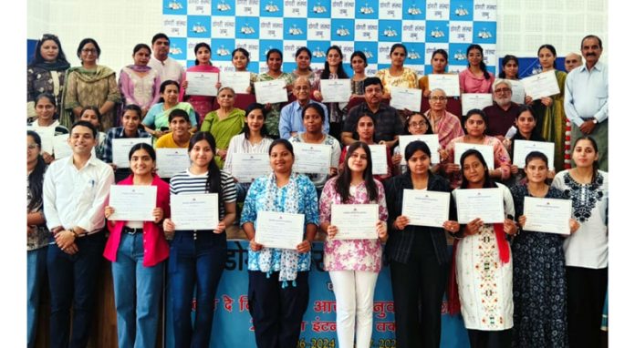 Participants of the workshop display partaking certificates during concluding function.