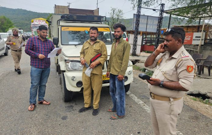 ARTO Jammu Mudasir Iqbal alongwith other officials during a drive against traffic violators on NH in Jammu on Wednesday.