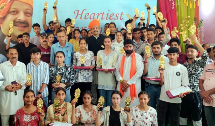 Senior BJP leader Devender Singh Rana with students, parents and teachers during a felicitation ceremony on Wednesday.