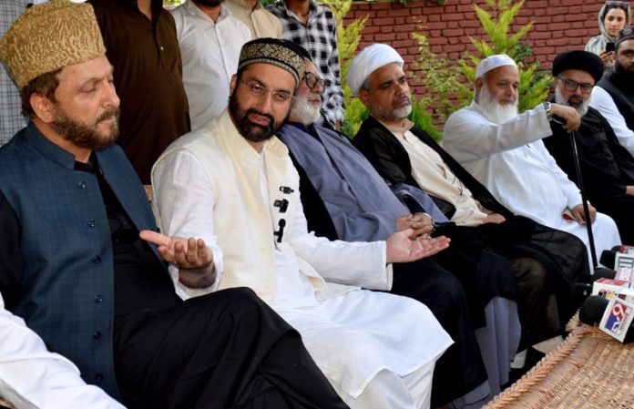 Mirwaiz Umar Farooq along with other religious leaders during a press conference at Nigeen on Monday. -Excelsior/Shakeel