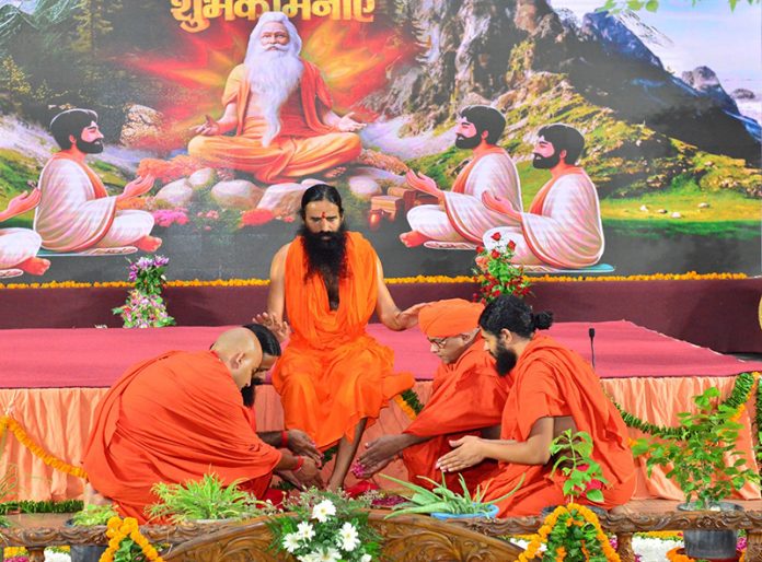 Disciples offering respect to their mentor, Swami Ramdev to celebrate Guru Purnima in Haridwar on Sunday.