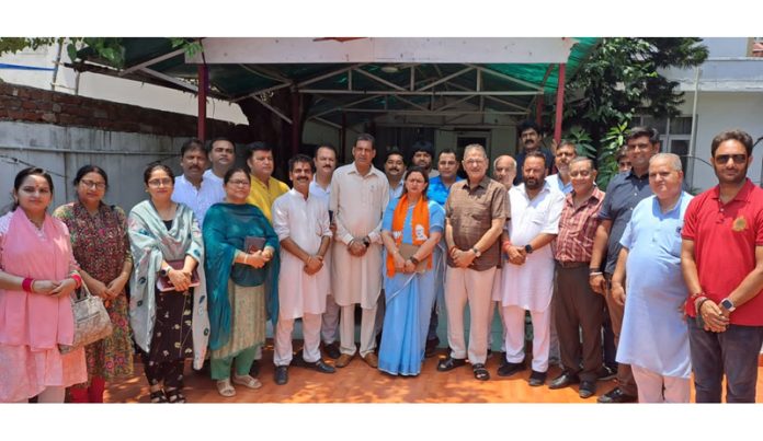 Senior BJP leader Kavinder Gupta posing with other party leaders during a function organised in Jammu on Sunday.
