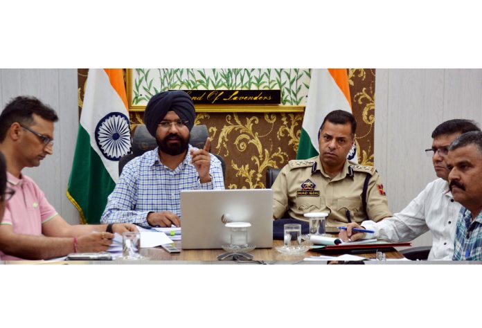 DC Doda Harvinder Singh chairing a meeting on Tuesday.