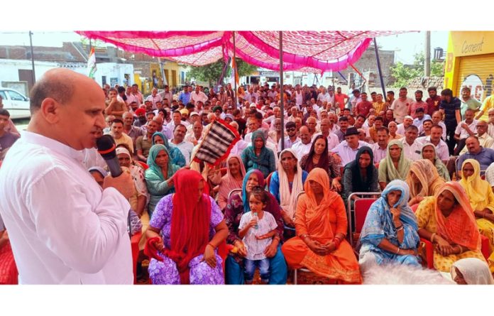 Ex-DyCM Tara Chand addressing public meeting at Gigrial in Chhamb on Wednesday.