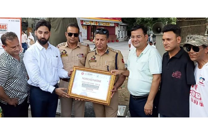 Officials from Aryan Group and senior officers of J&K Police posing together during a programme in Srinagar.