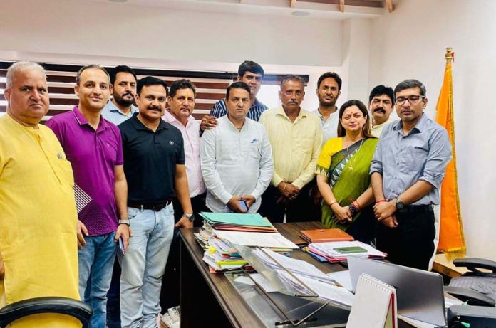 BJP delegation during a meeting with JMC Commissioner, Rahul Yadav at Jammu on Thursday.