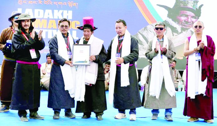 EC Tashi Namgyal Yakzee felicitating the participants of Nomadic Festival in Leh on Monday.