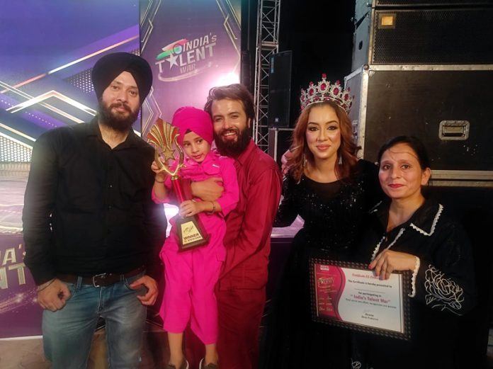 Hargun Kour posing along with others after winning the title of India’s Talent War Season 3 in Jammu on Thursday.