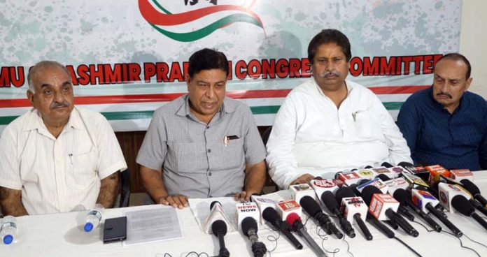 JKPCC senior leaders Raman Bhalla, Ravinder Sharma and others addressing press conference in Jammu on Friday. -Excelsior/Rakesh