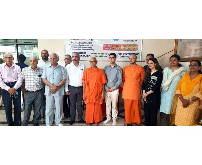 Management of Ramakrishna Mission Medical Centre, Udheywala, Jammu along with doctors posing during a health camp at Jammu on Saturday.
