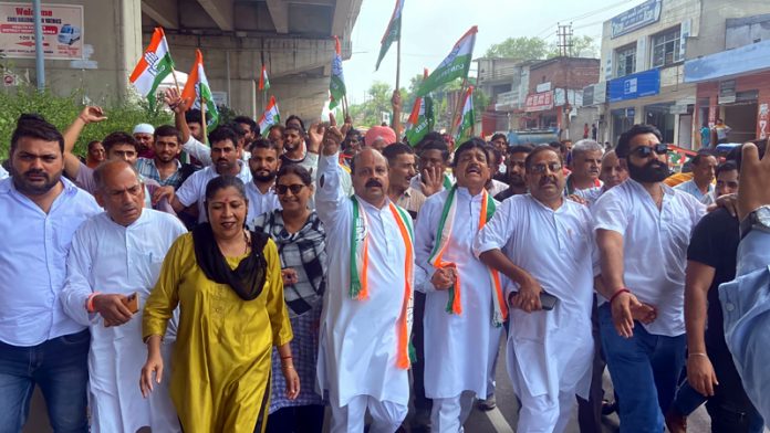 Cong activists staging protest against BJP Govt, at Samba on Wednesday.