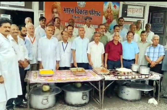 Members of Bharat Vikas Parishad celebrating Foundation Day in Reasi on Wednesday.