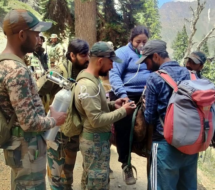 Army providing immediate oxygen supply to trekker at Gangabal.  