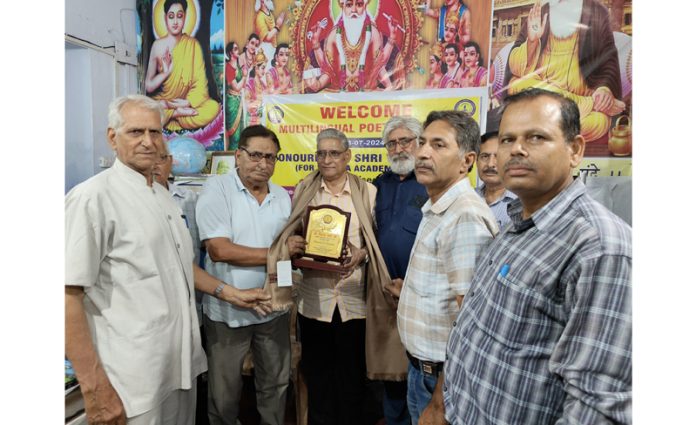 Renowned Dogri Writer, Vijay Verma being felicitated at a function in Jammu on Thursday.