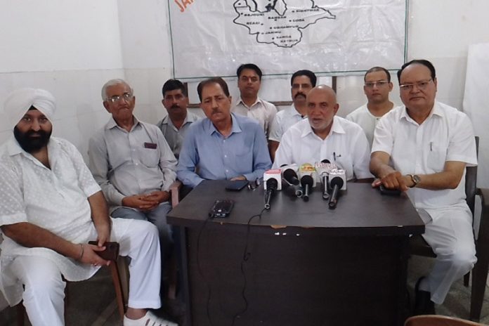 JPBM chairman, Ashok Sharma addressing a press conference at Jammu on Friday.