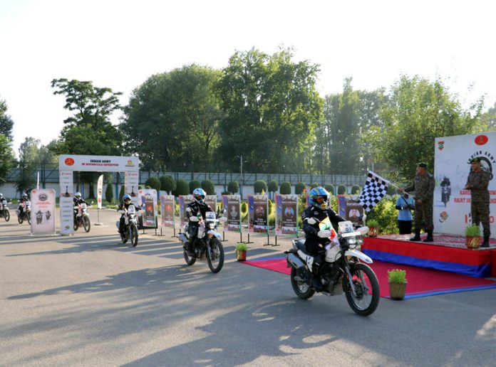 Army officer flagging off final leg of a D-5 motorcycle expedition on Monday.