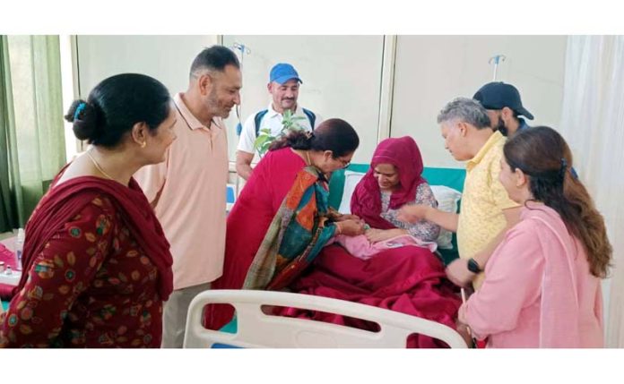 Police Hospital Jammu staff sharing joyous moments with the parents of a newborn baby in the hospital on Tuesday.
