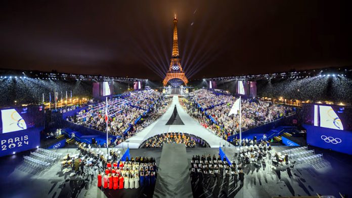 A view of Eiffel Tower bearing the olympic rings, lit-up ahead of Paris Olympic closing ceremony.