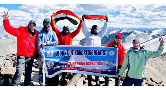 A team of climbers from Mountaineering Association of J&K posing along with the national flag on top of Kangri peak in Ladakh UT.