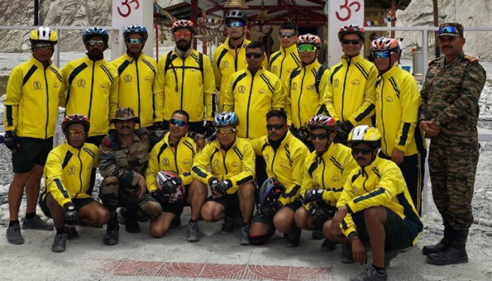 Cycle expedition team posing for group photograph.