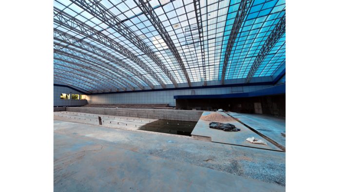 A view of incomplete all-weather swimming pool at MA Stadium, Jammu. -Excelsior/Rakesh