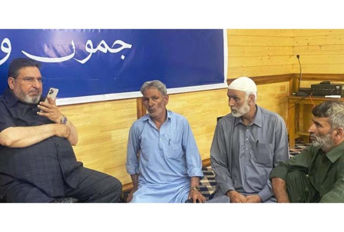 Syed Mohammad Altaf Bukhari interacting with a delegation at Apni Party Headquarters in Srinagar on Monday.