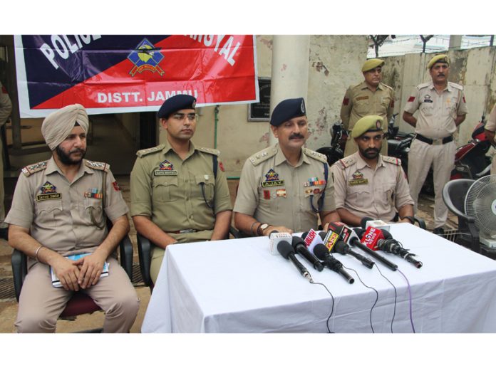 SP Jammu South Zone Ajay Sharma addressing a press conference at Police Station Gangyal on Saturday.