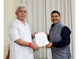 Gaurav Gupta presenting a memorandum of demands to LG Manoj Sinha.