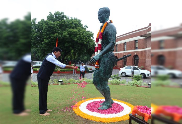 Union Sports Minister Mansukh Mandaviya pays floral tribute to Major Dhyan Chand on his birth anniversary, celebrated as National Sports Day, at Major Dhyan Chand National Stadium in New Delhi.