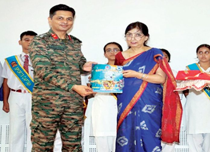 APS Nagrota Principal Ruchi Bahl presenting memento to the chief guest during a programme.