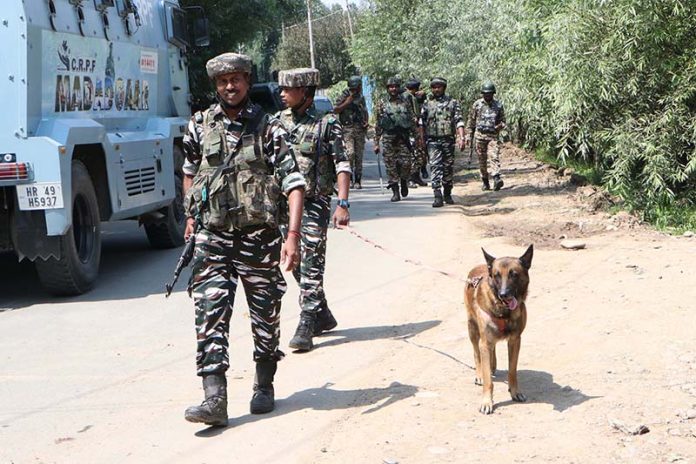 Security forces keep vigil in Kulgam district where an IED was found on Friday.