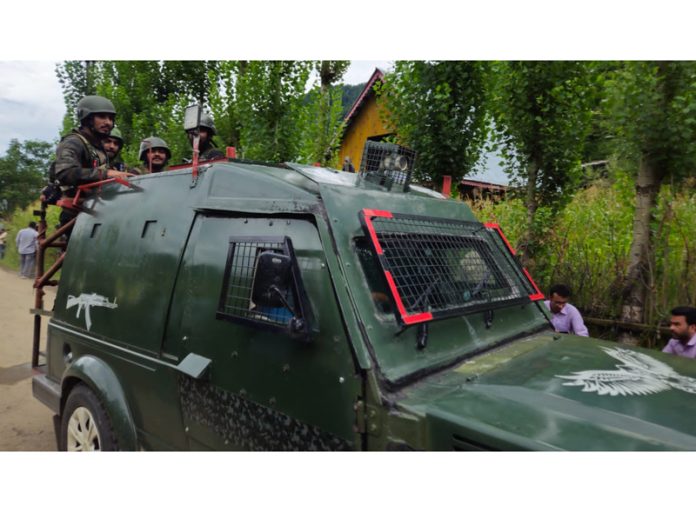 Troops near the encounter site at Kokernag on Sunday. —Excelsior/Sajad