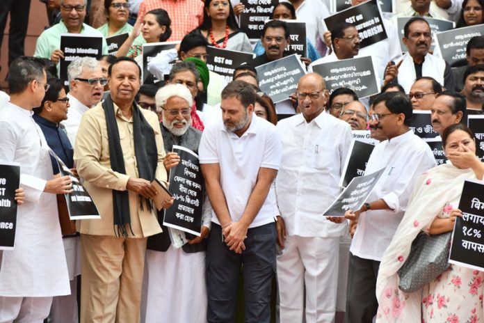 INDIA bloc MPs protest against the Central Government outside Makar Dwar in Parliament House on Tuesday. (UNI)