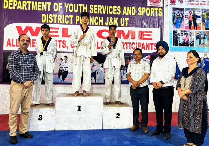 ADDC Poonch Sandesh Kumar Sharma along with young budding Taekwondo players.