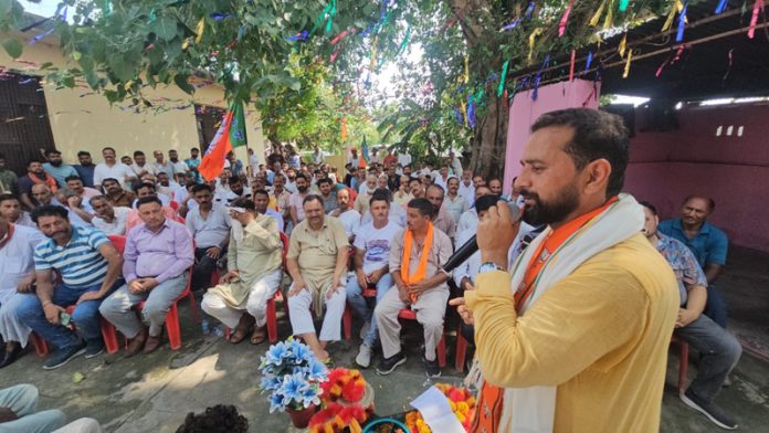 BJP State Executive Member Narinder Singh Bhau addressing a meeting in Khour Block of Chhamb Assembly Constituency.