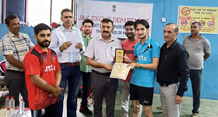 A Table Tennis player receiving memento from dignitary at Udhampur.