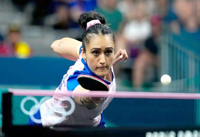 Manika Batra of India in action during her round of 16 team match against Bernadette Szocs.