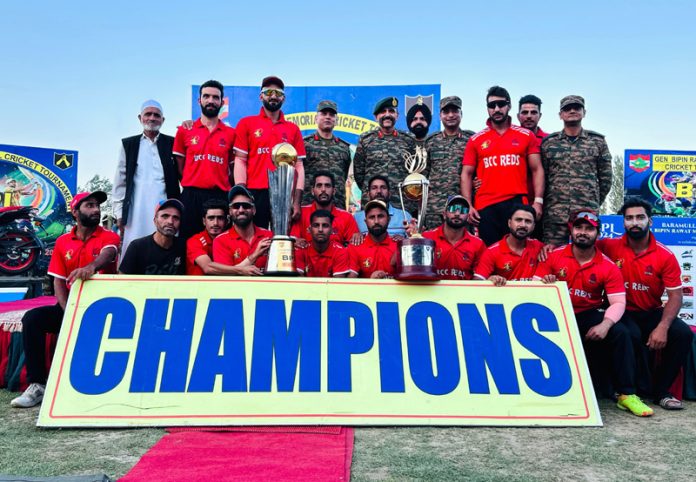 Winning team posing along with trophies and officers of Indian Army.