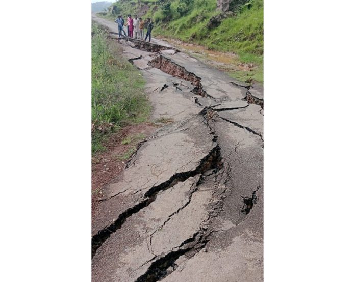 Damage caused to road after sinking of land in Darhal area of Rajouri. -Excelsior/Imran