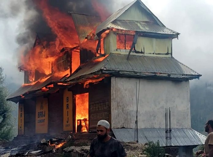 House on fire at Budhan in Reasi district. -Excelsior/Romesh Mengi