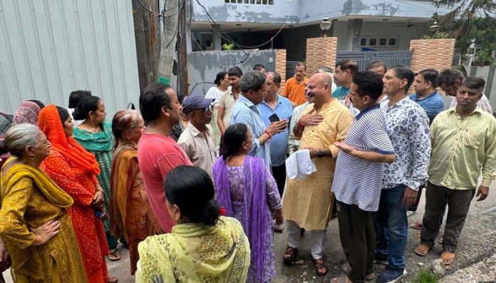 BJP vice president, Yudhvir Sethi interacting with people in ward No 19, Jammu East on Thursday.