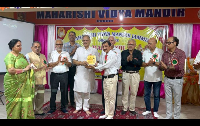 Memento being presented to chief guest Kavinder Gupta during a programme in MVM School, Sainik Colony, Jammu.